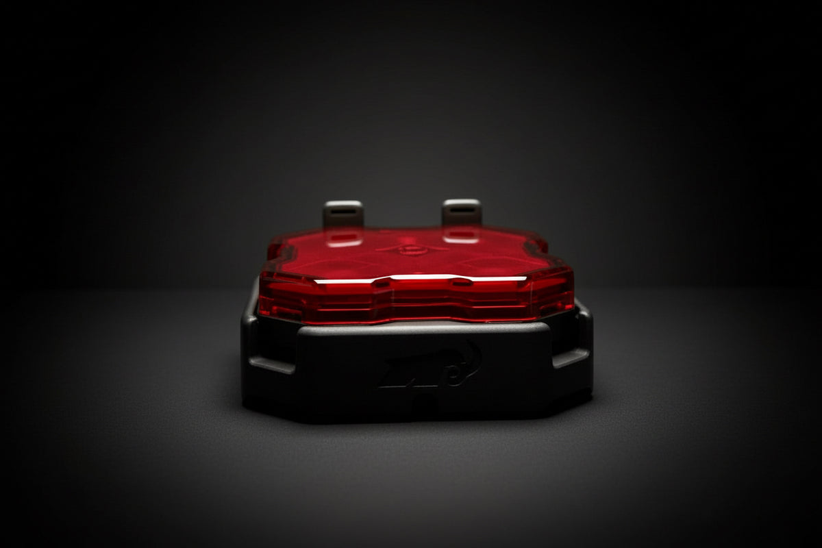 Red light on a dark marble surface with a black background