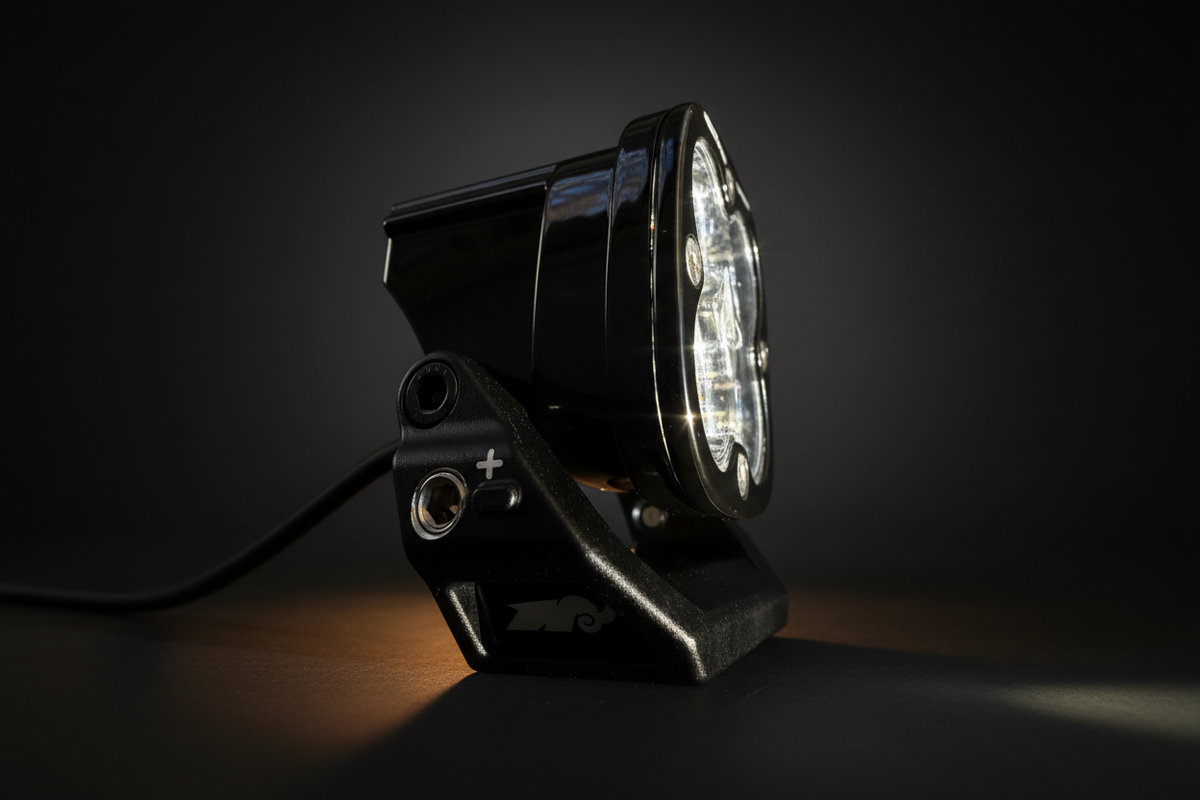 Black off-road vehicle light on a dark background