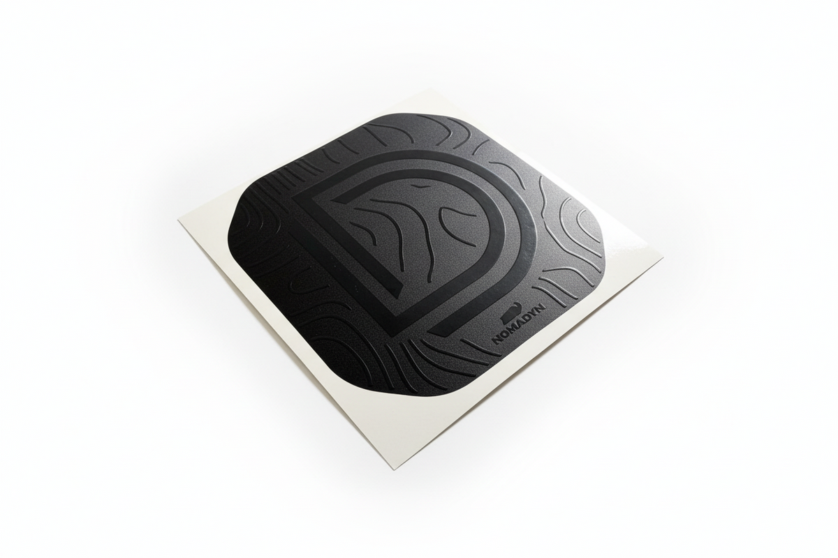 Black off road light cover decal with a double D logo on a white background