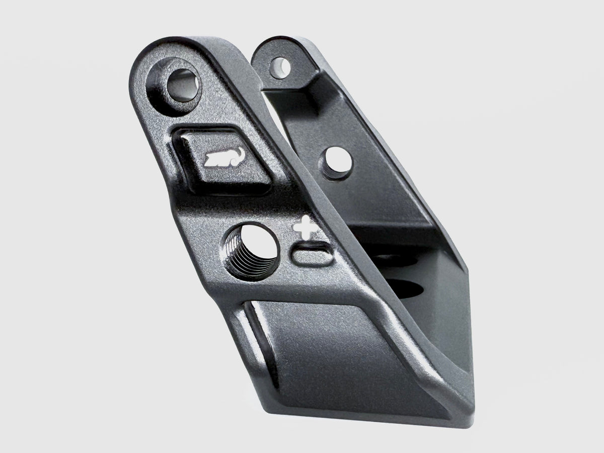 Metallic mechanical component on a light gray background