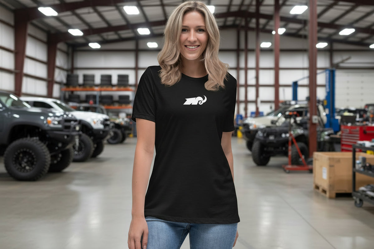 Person wearing a black t-shirt with a white logo on a white background